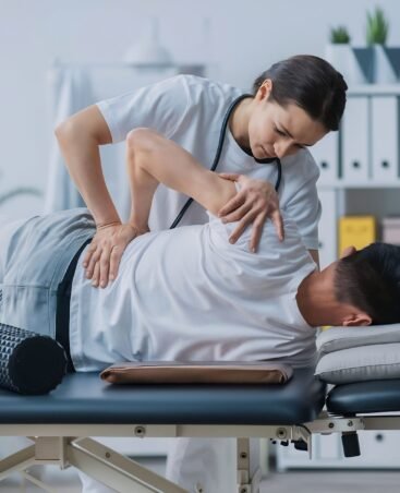 man-medical-office-physiotherapist-is-rehabilitating-back (1) man-medical-office-physiotherapist-is-rehabilitating-back (1)